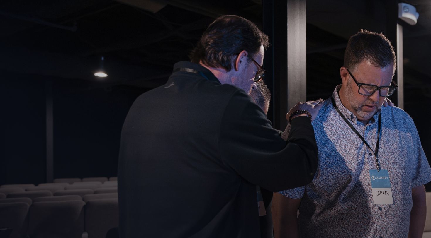A leader praying over another leader