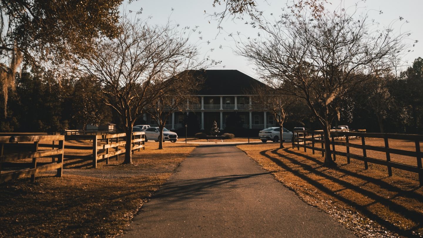 The grounds of a Clarity retreat house at sunset